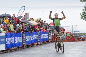 Trebon crosses the line as fans cheer in Gloucester. Photo: Todd Prekaski